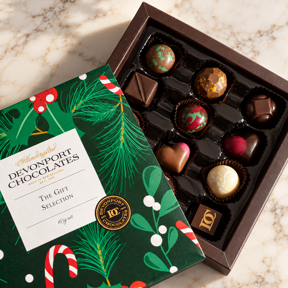Close-up of A Special Christmas bonbons and festive green gift packaging